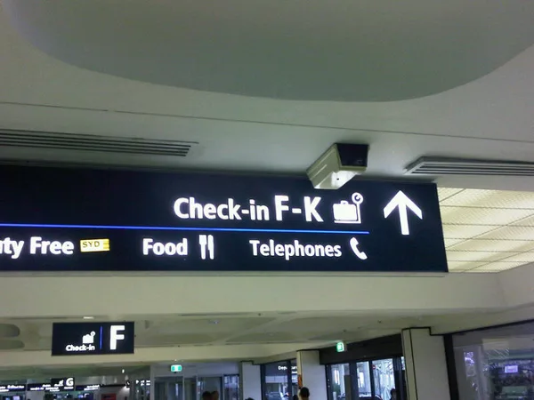 Watch your language, SYD airport sign!